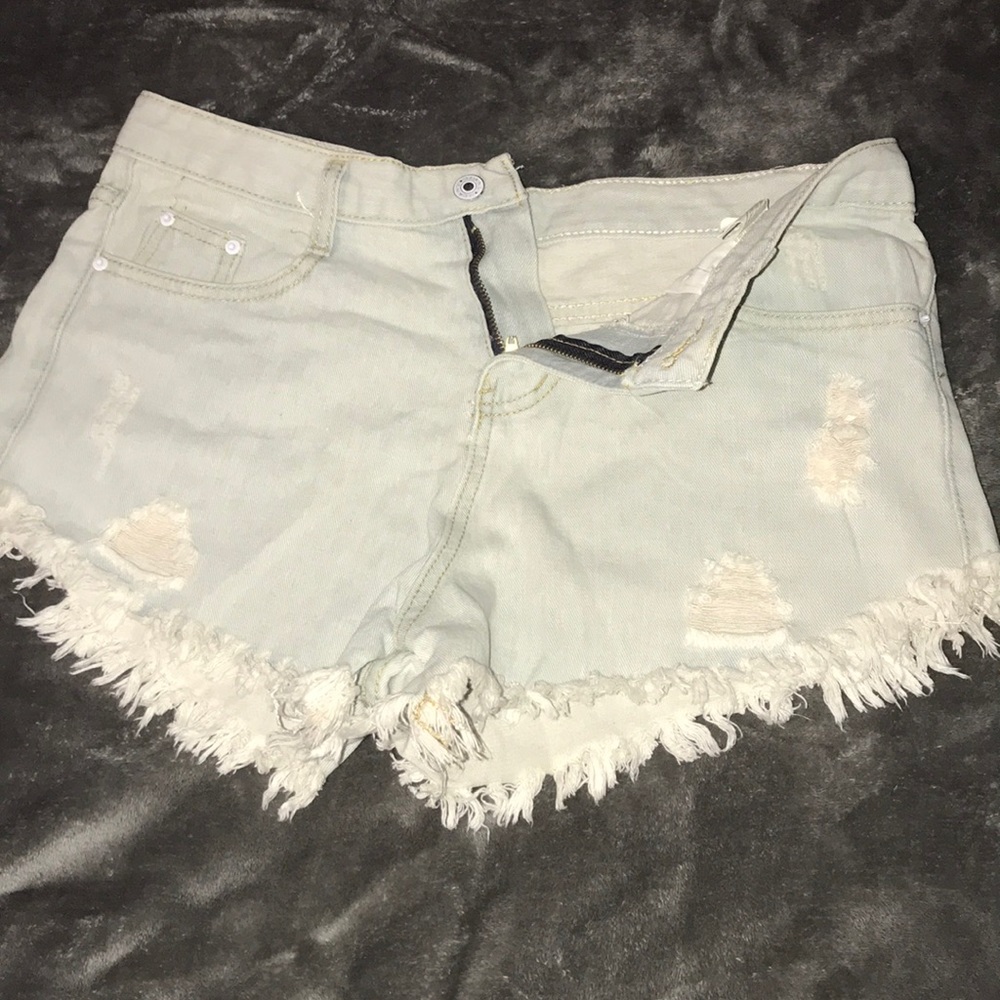 Daisy duke style shorts with distressed denim